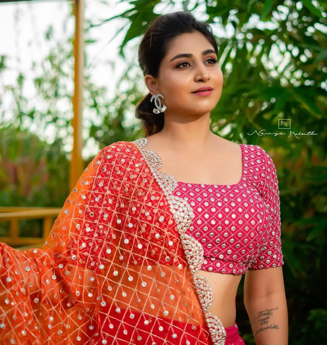 Varshini Sounderajan Wearing Orange Lehenga Choli